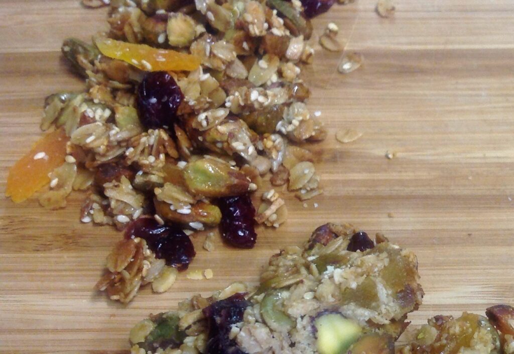 Homemade pistachio apricot and cherry granola made with Gustare Blood Orange Extra Virgin Olive Oil and Apricot Balsamic Vinegar, a wholesome gourmet snack or breakfast