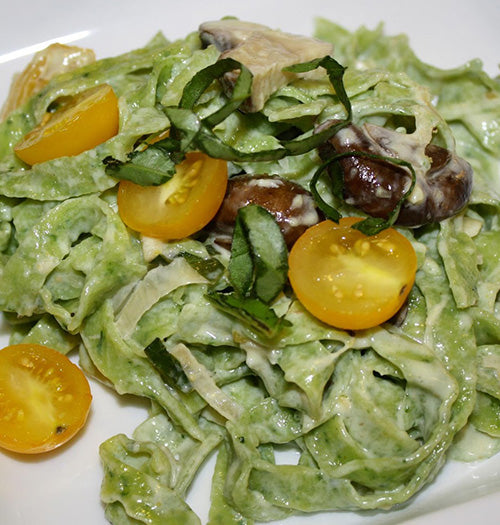 Creamy garlic mushroom sauce made with Gustare Gourmet's premium Garlic Extra Virgin Olive Oil served over fresh salad - gourmet sauce recipe with artisan ingredients