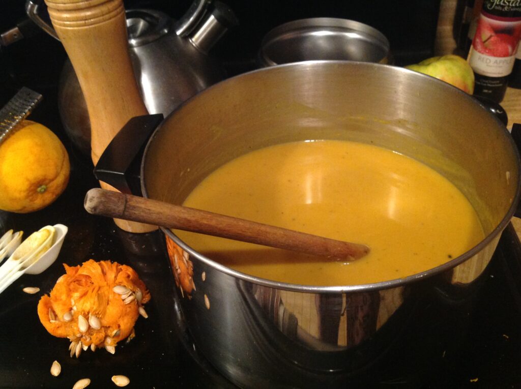 Golden curried butternut squash and apple soup made with Gustare Gourmet's Blood Orange Extra Virgin Olive Oil and 18-Year Traditional Balsamic Vinegar