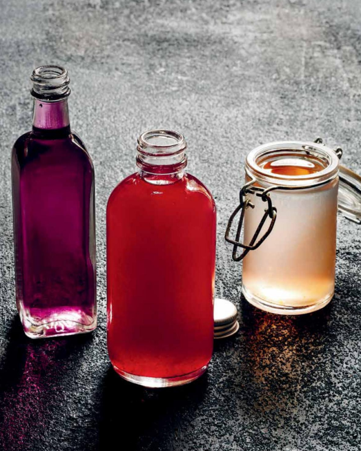Homemade raspberry cocktail syrup with Gustare Italian Raspberry Balsamic Vinegar in bottles