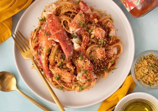 Succulent lobster meat in creamy tomato parmesan sauce over bucatini topped with golden, seasoned breadcrumbs and fresh parsley.