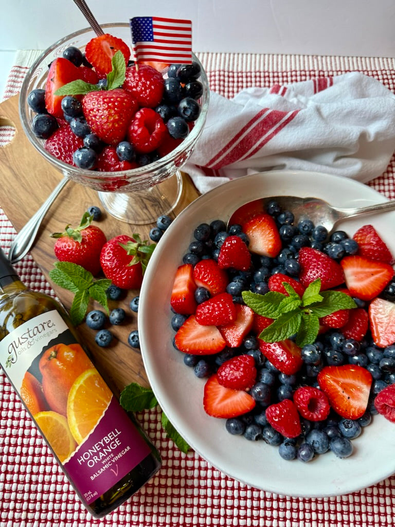 Fresh strawberries and blueberries glazed with our premium Honeybell Orange Balsamic Vinegar, served in a delicate meringue heart for an elegant gourmet dessert.